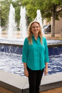 Melissa Wilkinson standing in front of Rudder Fountain